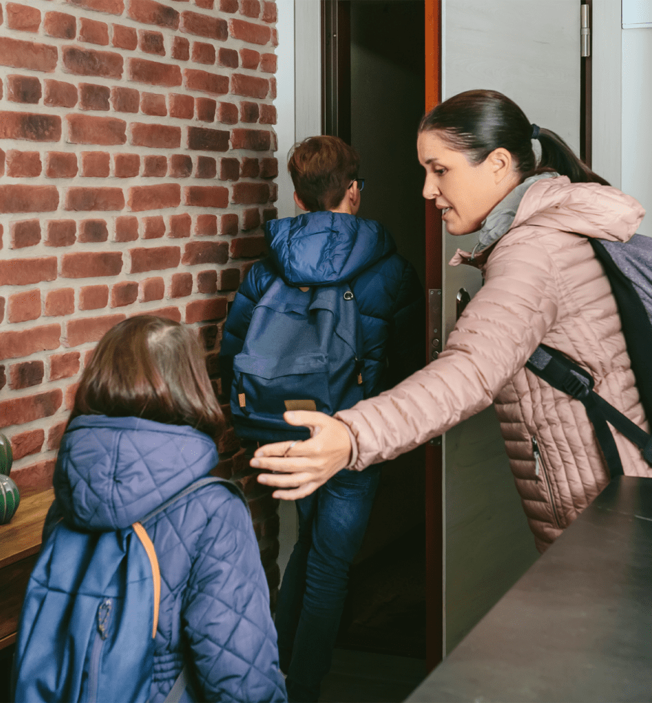 Family With Emergency Backpacks Leaving Their Front Door Quickly